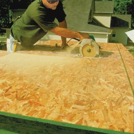 Man Cutting Plywood & OSB | Construx Building