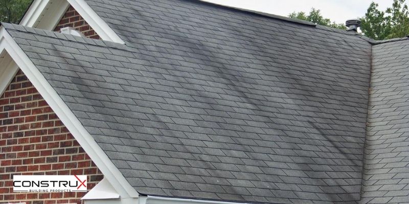 The appearance of dark patches on your roof